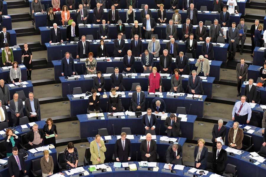 Members of the European Parliament observe a minute of silence for the victims of an accident in which 28 people, including 22 children, died in Switzerland, on March 14, 2012, at the European Parliament in Strasbourg, in northeastern of France.  AFP PHOTO/FREDERICK FLORIN