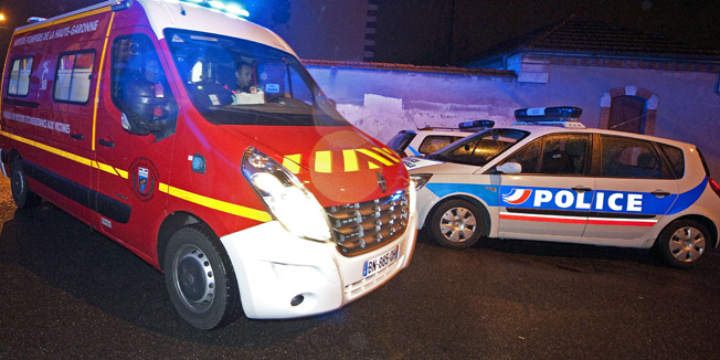 An ambulance of firefighters leaves a street near the place where French policemen, members of the RAID special forces unit, attempt to arrest a suspected Al-Qaeda gunman on March 21, 2012 in Toulouse, southwestern France. A police operation was still underway more than three hours later as the sun rose, and it was thought that the 24-year-old suspect -- accused of killing seven people in recent days -- was resisting arrest.   AFP PHOTO/PASCAL PAVANI