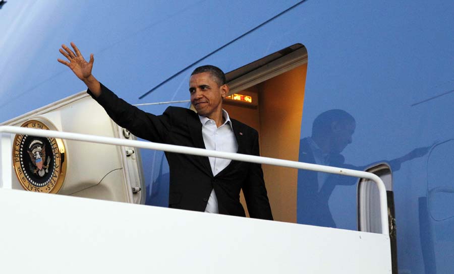 President Barack Obama waves on his departure at Roswell International Air Center Airport, Wednesday, March, 21, 2012 in Roswell, N.M. (AP Photo/Pablo Martinez Monsivais)
