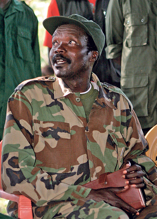 The leader of the Lord's Resistance Army, Joseph Kony answers journalists' questions  following a meeting with UN humanitarian chief Jan Egeland Sunday Nov 12 , 2006 at Ri-Kwamba in Southern Sudan. Egeland met  with Kony, the elusive leader of Uganda's notorious rebel Lord's Resistance Army and one of the world's most-wanted war crimes suspects. Egeland was seeking to secure the release of women and children enslaved by the group during their 20-year conflict with the Ugandan government. But Kony denied that his forces are holding prisoners.( AP Photo/Stuart Price, Pool)