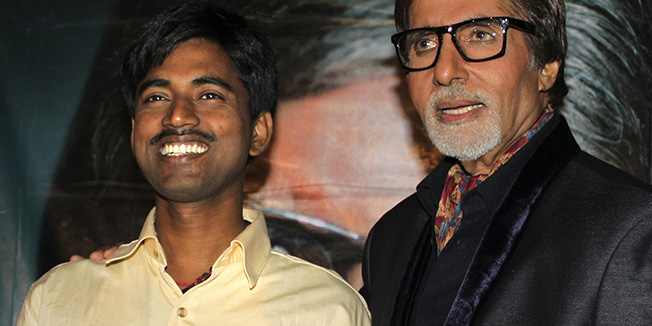 In this Tuesday, Oct. 25, 2011, photograph, Sushil Kumar, left, with Bollywood actor Amitabh Bachchan, shows $1 million check after winning on an Indian game show, in Mumbai, India.  Kumar, a government clerk from a desolate region of eastern India, has become the first person ever to win $1 million on the popular Indian version of 