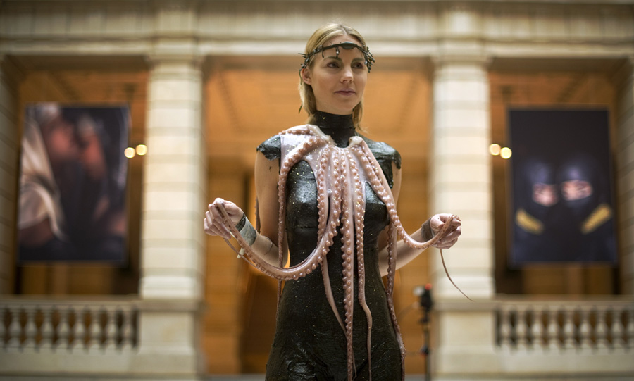 A model wears a creation made of seaweed and octopus by chef and food designer from South Tyrol Roland Trettl at the communications museum (Museum fuer Kommunikation) in Berlin on October 28, 2011. From October 29, 2011 to January 29, 2012, the museum presents around 50 photographs created by Trettl and photographer Helge Kirchberger, showing models wearing eatable Haute Couture fashion made of vegetables, fish skin, octopuses, caul fat and other food.           AFP PHOTO / ODD ANDERSEN