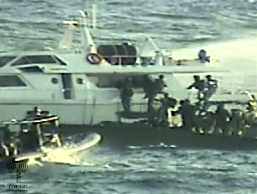 In this video image released by the Israeli Defense Ministry Friday, Nov. 4, 2011, Israeli soldiers on several small military boats appear to board a civilian boat believed to be one of two protest boats trying to violate Israel's blockade of the Gaza Strip. Israel's navy boarded two protest boats trying to break the blockade of the Gaza Strip on Friday and towed them to an Israeli port just north of the Palestinian territory, officials said. (AP Photo/Israeli Army, ho)  EDITORIAL USE ONLY