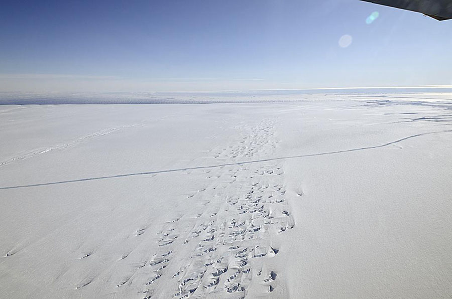 In this image obtained from NASA, the space agency's DC-8 flies over the Pine Island Glacier Ice Shelf on October 14, 2011, studying the crack spreading across the ice shelf. The massive crack is growing wider in the Antarctic ice sheet and could break apart in the coming months, forming an iceberg the size of Brazil, NASA scientists warned on Novermber 3, 2011. The crack in western Antarctica stretches for at least 18 miles (30 kilometers) and runs 165 feet (50 meters) deep. The rift is widening at a rate of 6.5 feet (two meters) per day, said NASA project scientist Michael Studinger. = RESTRICTED TO EDITORIAL USE - MANDATORY CREDIT 