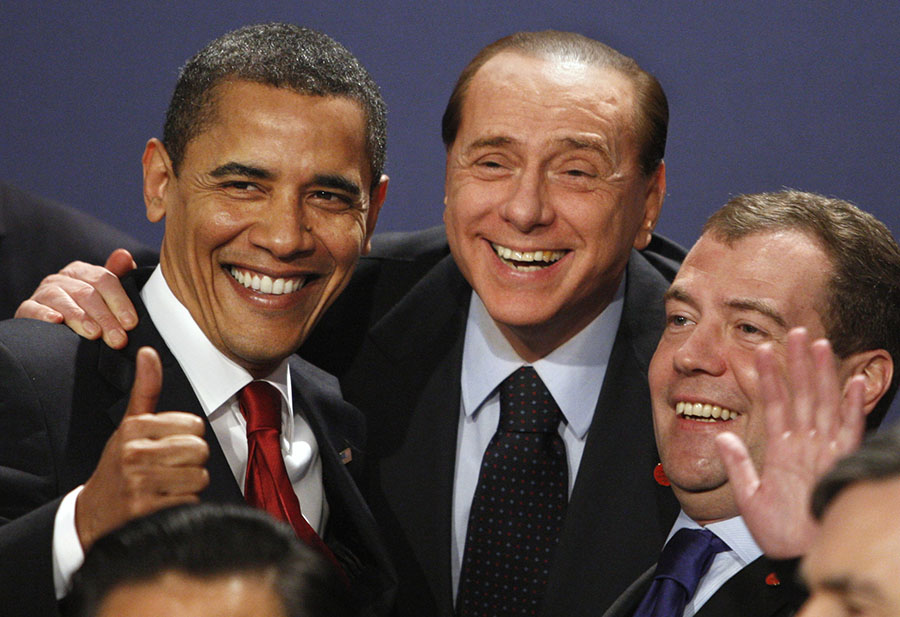 FILE - In this April 2, 2009 file photo, President Barack Obama, Italian Prime Minister Silvio Berlusconi, center, and Russian President Dmitry Medvedev smile during a group photo at the G20 Summit in London.  In 2009 President Barack Obama went to London for his first summit of the worlds top 20 economies as a global rock star _ the U.S. president who as a candidate could command giant crowds in Denver or Berlin. This week he arrives in Cannes, France, for another G-20 summit with his star status on the wane, more like a key player in the band instead of the conductor.(AP Photo/Kirsty Wigglesworth, File)