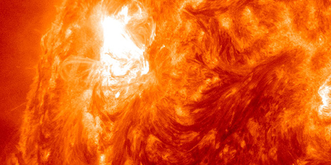 This image provided by NASA shows giant sun spot activity Thursday, Nov. 3, 2011, from a region on the sun that scientists are calling a 