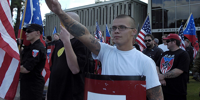 Members of the National Socialist Movement hold a rally against illegal immigration in Pomona, Calif. on Saturday, Nov. 5, 2011. Neo-Nazis were outnumbered by counter-protestors. (AP Photo/Inland Valley Daily Bulletin, Thomas R. Cordova)