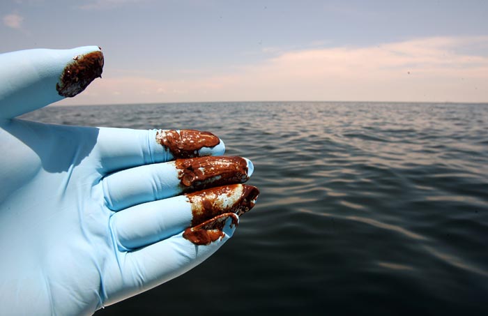 Suspended oil found floating in a huge sheen two and a half miles west southwest of the far west end of Dauphin Island, Ala. Wednesday June 2, 2010 as oil leaking from the Deepwater Horizon wellhead continues to spread in the Gulf of Mexico. The location was between Dauphin Island (Ala.) and Petit Bois Island (Miss.)  (AP Photo/Press-Register, John David Mercer) 