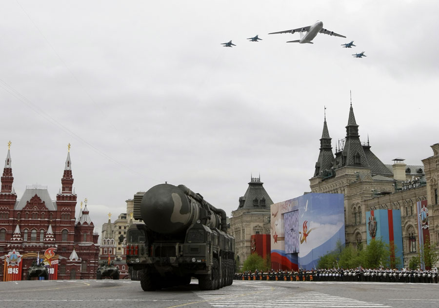 In this Thursday, May 6, 2010 file photo Russian army strategic missile Topol-M is on Red Square as Russsian Army jets fly over during general rehearsals ahead of the upcoming Victory Day Parade, in Moscow. If Washington continues to ignore Russia's demands about a proposed U.S. missile shield in Europe, Russia will deploy new missiles aimed at it and put arms control on hold, President Dmitry Medvedev said Wednesday.(AP Photo/Misha Japaridze)