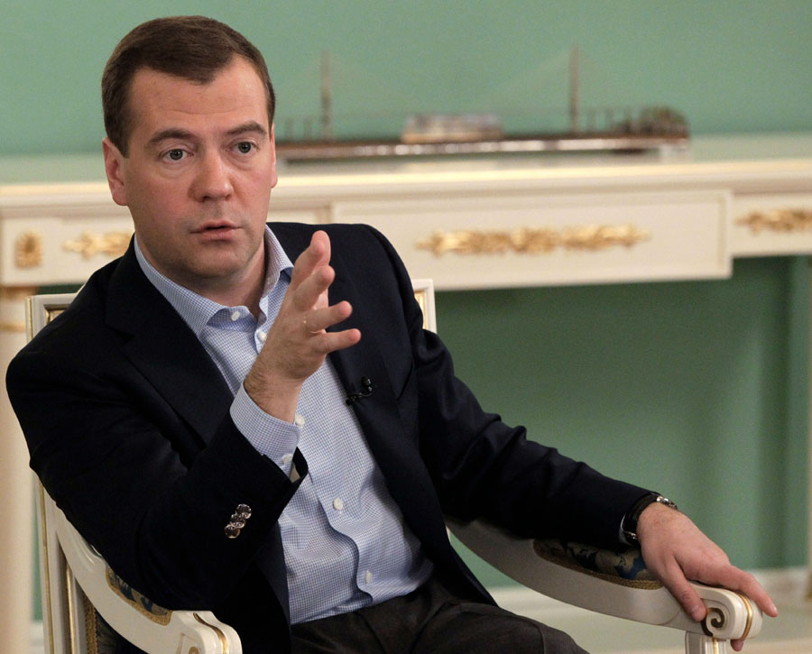 Russian President Dmitry Medvedev, right, gestures while speaking to a group of Russian regional journalists in the Gorki residence outside Moscow, Russia, Friday, Nov. 25, 2011.(AP Photo/RIA-Novosti, Mikhail Klimentyev, Presidential Press Service)