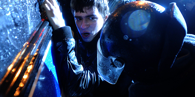 A riot policeman detains an opposition supporter during a rally in central Moscow on December 5, 2011. Thousands of Russians rallied in central Moscow and Saint Petersburg protesting against violations in legislative elections that handed victory to Vladimir Putin's ruling party with a reduced majority.    AFP PHOTO/ ANDREY SMIRNOV