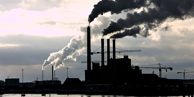 FILE   This is a  Feb. 7, 2007 file photo of the  Avedoere Power station at Avedoere Holme, south of Copenhagen. The European Environment Agency says air pollution cost Europe more than euro100 billion ($134 billion) in 2009 including  making workers sick and damaging crops. (AP Photo/POLFOTO, Thomas Borberg, file) DENMARK OUT
