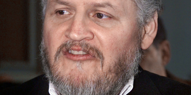 (FILES) - A picture taken at the Paris courthouse 07 March 2001, shows Venezuelan terrorist Illich Ramirez Sanchez, aka Carlos the jackal(C), arriving for his appeal against French anti-terrorist judge Jean-Louis Bruguiere. Carlos the Jackal was sentenced on December 15, 2011 to a life sentence with a minimum of 18 years at the end of his trial for 