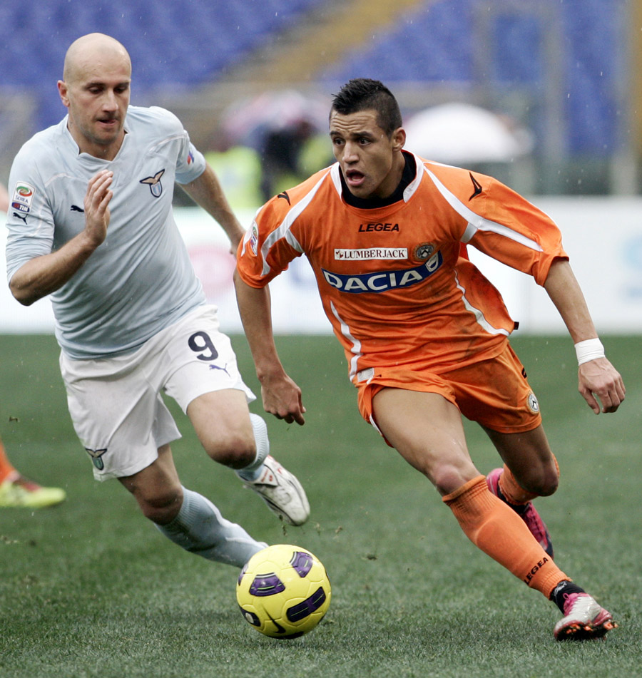 Udinese forward Alejandro Sanchez, of Chile, right, is chased by Lazio forward Tommaso Rocchi during a Serie A soccer match at Rome's Olympic stadium, Sunday, Dec. 19, 2010. (AP Photo/Riccardo De Luca)