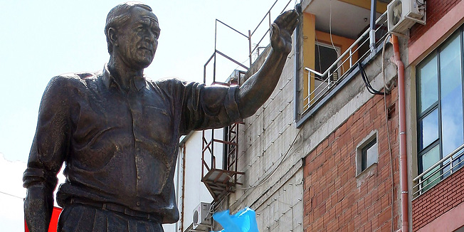 Albanian Prime Minister Sali Berisha (bottom R) unveils a statue of former US President George W. Bush in downtown Fushekruje on July 6, 2011. George W. Bush was the first US president to ever visit Albania, a staunch US ally, in June 2007. The statue commemorates his short visit in the town where he was enthusiastically greeted by local residents.   AFP PHOTO / GENT SHKULLAKU