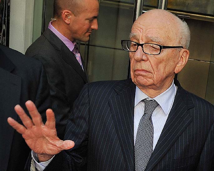 News Corporation Chief Rupert Murdoch speaks to the media after meeting the family of murdered British school girl Milly Dowler in London, on July 15, 2011. Rupert Murdoch will use advertisements in British national newspapers on Saturday to apologise for 