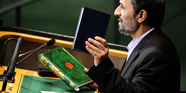 Iran's President Mahmoud Ahmadinejad displays a copy of the Koran ans a Biblr as he addresses the 65th General Assembly at the United Nations headquarters in New York, September 23, 2010. AFP PHOTO/Emmanuel Dunand