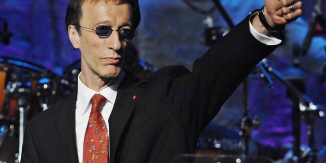 FILE - In this May 15, 2007, file photo, The Bee Gees' Robin Gibb salutes the crowd after The Bee Gees were named BMI Icons during the 55th Annual BMI Pop Awards in Beverly Hills, Calif. A representative said on Sunday, May 20, 2012, that Gibb has died at the age of 62. (AP Photo/Chris Pizzello, File)