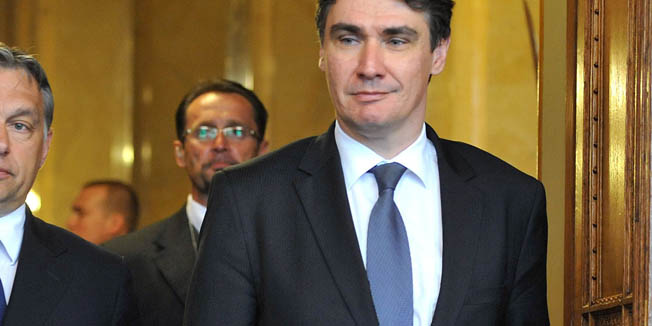 Croatian Prime Minister Zoran Milanovic, right, and his Hungarian counterpart Viktor Orban arrive for a joint press conference in the Parliament building in Budapest, Hungary, Monday, May 7, 2012. Milanovic is staying on a one-day official visit in Hungary. (AP Photo/MTI, Tamas Kovacs)