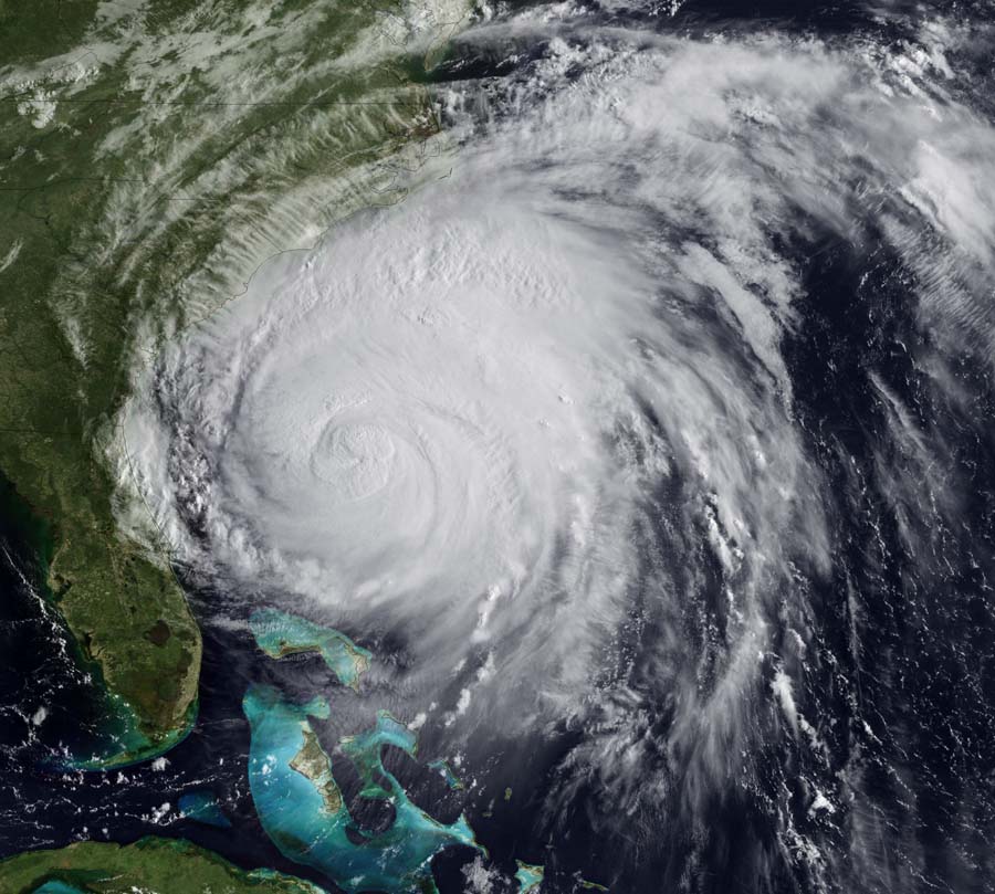 This NOAA image taken by the GOES-East satellite shows Hurricane Irene approaching the US East coast on August 26, 2011 at 1245z. Millions of people on the US east coast braced for the hurricane, a massive storm officials fear will cause widespread flooding and dangerous conditions up the seaboard. Officials from North Carolina to New York declared states of emergency as tens of thousands of the most vulnerable residents were ordered to higher ground as Irene raced toward the US mainland. AFP PHOTO/NASA/NOAA/HANDOUT/RESTRICTED TO EDITORIAL USE - MANDATORY CREDIT 