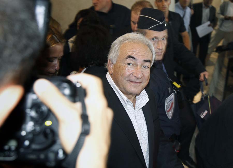 Former International Monetary Fund (IMF) leader Dominique Strauss-Kahn leaves the Roissy-Charles-de-Gaulle International Airport on September 4, 2011 in Roissy-en-France, near Paris, after flying from New-York. Strauss-Kahn, 62, resigned as the IMF's managing director in May 2011 after he was arrested and charged with the sexual assault and attempted rape of a hotel maid. His return to France has caused embarrassment for his opposition party as it prepares to vote in a primary to choose a candidate to run against the incumbent French President, next year.       AFP PHOTO / THOMAS COEX