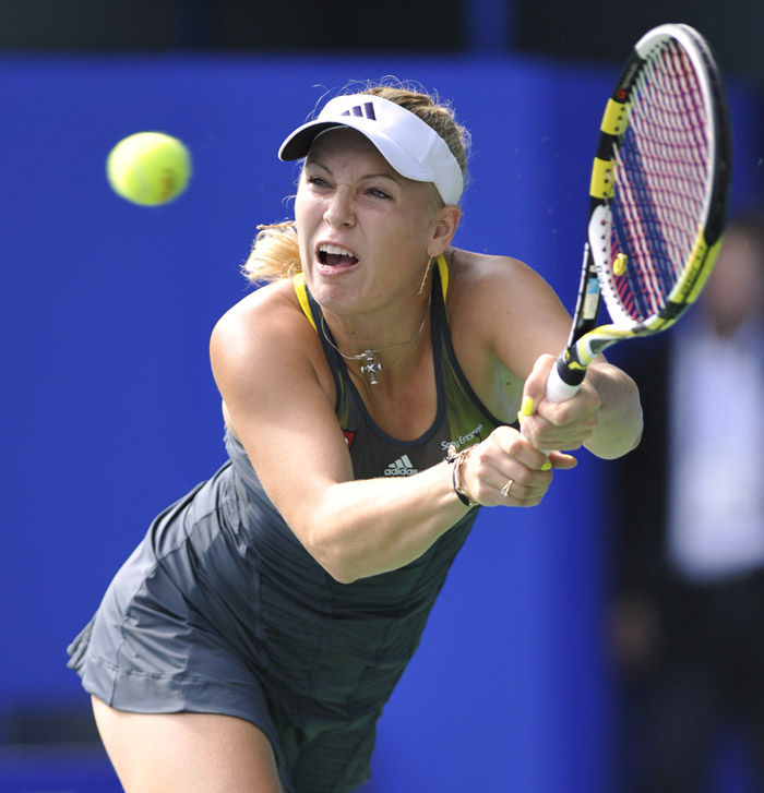 Caroline Wozniacki of Denmark returns against Victoria Azarenka of Belarus during their women's singles semi-final match at the Pan Pacific Open tennis tournament in Tokyo on October 1, 2010. Wozniacki beat Azarenka 6-2, 6-7, 6-4.    AFP PHOTO/Kazuhiro NOGI