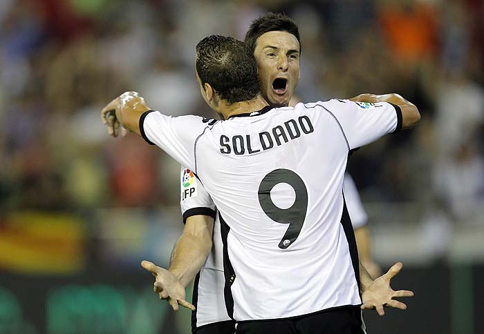 Valencia's Aritz Aduriz  celebrates and Alberto Soldado after  Aritz Aduriz scoring against during their Spanish La Liga soccer match against  Athletic Bilbao at Mestalla stadium in Valencia, Spain Saturday Oct. 2,  2010. (AP Photo/Alberto Saiz)