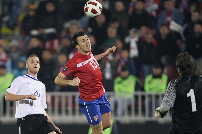 Serbia's Aleksandar Lukovic, center, scores a goal during their Euro 2012 group C qualifying soccer match against Estonia, in Belgrade, Serbia, Friday, Oct. 8, 2010. (AP Photo/Darko Vojinovic)