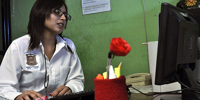 Twenty-year-old Marisol Valles Garcia sits at her desk after her swearing-in ceremony as the new police chief of the border town of Praxedis G. Guerrero, near Ciudad Juarez, Mexico, Wednesday, Oct. 20, 2010. Praxedis G. Guerrero was once a quiet farming town until two rival gangs, the Juarez and the Sinaloa drug cartels, began battling for the control of its single highway. (AP Photo/Raymundo Ruiz)  