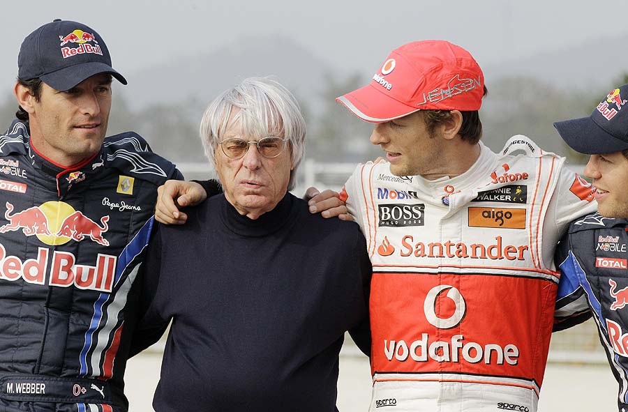 Formula One boss Bernie Ecclestone, second left, poses for a photo with some of drivers championship contenders from left, Red Bull Formula One driver Mark Webber of Australia, McLaren Formula One driver Jenson Button of Britain and Red Bull Formula One driver Sebastian Vettel of Germany at the Korean International Circuit venue for the Korean Grand Prix in Yeongam, South Korea, Thursday, Oct. 21, 2010. Yeongam will be host to Korea's first Formula One race on Sunday Oct 24. (AP Photo/Lee Jin-man )