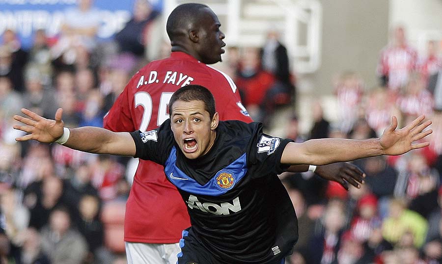 Manchester United's Javier Hernandez celebrates scoring his teams second goal during their English Premier League soccer match against Stoke City at the Britannia stadium, Stoke, England. Sunday, Oct. 24, 2010. (AP Photo/Simon Dawson)**NO INTERNET/MOBILE USAGE WITHOUT FOOTBALL ASSOCIATION PREMIER LEAGUE (FAPL) LICENCE. CALL +44 (0) 20 7864 9121 or EMAIL info@football-datco.com FOR DETAILS **