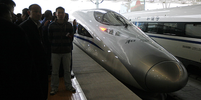 The first bullet train of a new high-speed railway linking Shanghai with Hangzhou travels to Hangzhou Tuesday, Oct. 26, 2010 in Shanghai, China. Shanghai-Hangzhou high-speed railway start the operation Tuesday. (AP Photo/Eugene Hoshiko)
