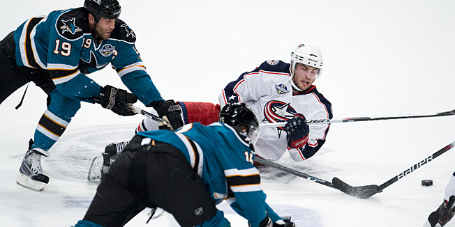 San Jose Sharks 's Dany Heatley  (C, front) and Joe Thornton (L) fight for the puck with Columbus Blue Jackets's Derick Brassard  during their National Hockey League (NHL) season game at the Globe Arena on October 9, 2010 in Stockholm, Sweden. The Columbus Blue Jackets beats San Jose Sharks 3-2. AFP PHOTO/JONATHAN NACKSTRAND =GETTY OUT=