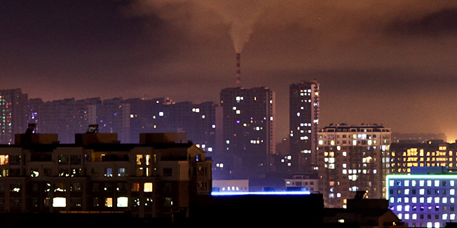 In this Wednesday Sept. 1, 2010 photo, a chimney of a coal-fired power plant emit smoke during the night in Changchun in northeast China's Jilin province. As the world's biggest greenhouse gas producer, China was widely seen as an obstacle in the Copenhagen climate summit last year. But while negotiations inched forward, Beijing poured $34.6 billion into clean energy in 2009, nearly double the U.S. investment. (AP Photo) CHINA OUT 