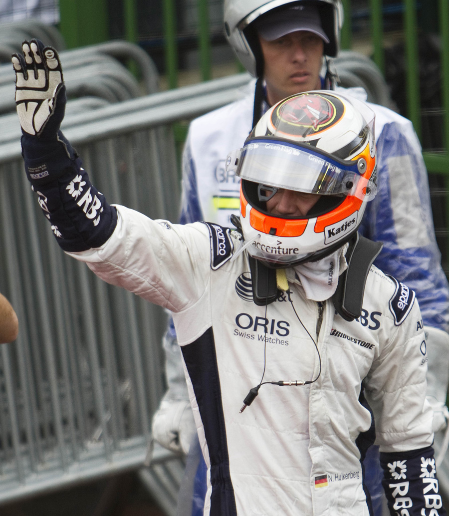 German Formula One driver Nico Hulkemberg celebrates after taking the pole position for Sunday's Brazilian Grand Prix, at Interlagos racetrack in Sao Paulo on November 6, 2010. Hulkenberg took pole here on Saturday, for the penultimate race of the season.  AFP PHOTO/JEFFERSON BERNARDES