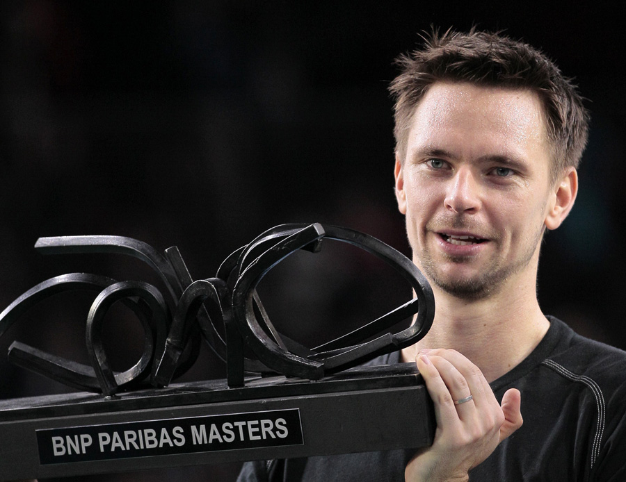 Swedish Robin Soderling holds his trophy after he won the Paris masters 1000 ATP tournament final tennis match on November 14, 2010 at the Paris Bercy (POPB) in Paris.  AFP PHOTO JACQUES DEMARTHON
