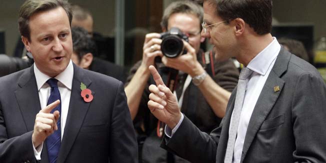 British Prime Minister David Cameron, left, speaks with new Dutch Prime Minister Mark Rutte during a round table meeting at an EU summit in Brussels on Thursday, Oct. 28, 2010. European Union leaders, opening a two-day summit Thursday, are at pains to inject more financial discipline into eurozone nations to prevent another debt crisis from gutting confidence in Europe's single currency. (AP Photo/Yves Logghe)