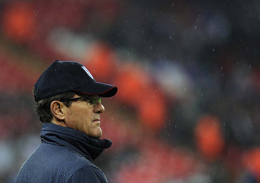 England manager Fabio Capello watches the warm-up before the international friendly soccer match between England and France at Wembley stadium in London, Wednesday, Nov. 17, 2010.  (AP Photo/Tom Hevezi)