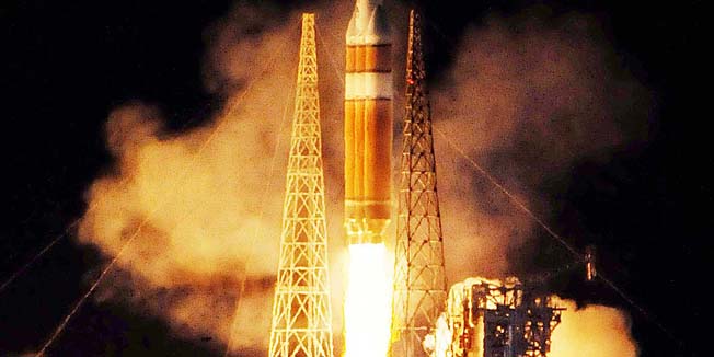 The 23-story Delta 4-Heavy rocket, carrying a spy satellite, blasts off from Launch Complex 37 at Cape Canaveral Air Force Station in Cape Canaveral, Fla., early Sunday, Nov. 21, 2010. The rocket took off after several delays over the past few months because of technical glitches, including a problem during fueling for a launch on Friday. Weather concerns on Sunday cleared shortly before launch time. (AP Photo/Florida Today, Craig Rubadoux) NO SALES; MAGS OUT