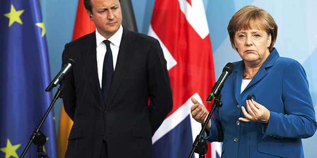 German Chancellor Angela Merkel, right, and Britain's Prime Minister David Cameron brief the media prior to a bilateral meeting at the chancellery  in Berlin, Germany, Thursday, June 7, 2012. (AP Photo/Markus Schreiber)