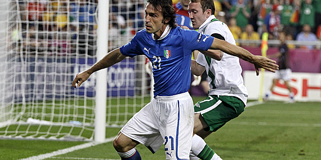 Italy's Andrea Pirlo, left, and Ireland's Aiden McGeady vie for the ball during the Euro 2012 soccer championship Group C match between Italy and the Republic of Ireland in Poznan, Poland, Monday, June 18, 2012. (AP Photo/Sergey Ponomarev) 