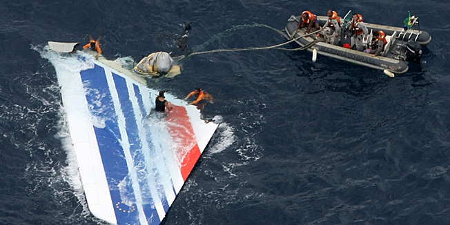 FILE - In this Monday, June 8, 2009 file photo released by Brazil's Air Force, Brazil's Navy sailors recover debris from the missing Air France Flight 447 in the Atlantic Ocean. A combination of faulty sensors and mistakes by inadequately trained pilots caused an Air France jet to plunge into the Atlantic Ocean in 2009, killing all 228 people aboard in the airline's deadliest ever crash, French investigators said Thursday July 5, 2012. (AP Photo/Brazil's Air Force)  