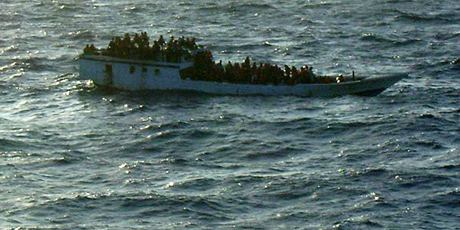 This June 27, 2012 photo released by Australian Maritime Safety Authority shows a boat carrying asylum seekers 200 kilometers (120 miles) north of Christmas Island in the Indian Ocean hours before capsizing Wednesday, June 27, 2012. The boat capsized Wednesday and 123 people were rescued from the ocean, Prime Minister Julia Gillard said, less than a week after more than 90 people drowned on a similar journey. (AP Photo/Australian Maritime Safety Authority) 