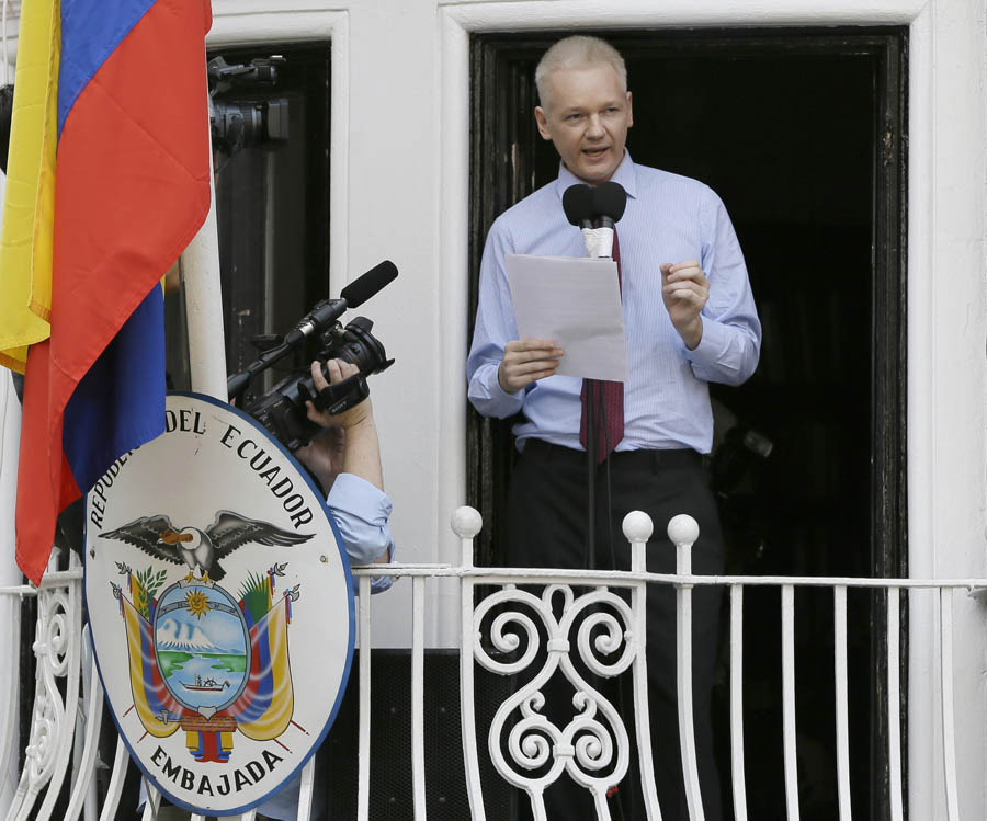 Julian Assange, founder of WikiLeaks makes a statement from a balcony of the Equador Embassy in London, Sunday, Aug. 19, 2012. Julian Assange entered the embassy in June in an attempt to gain political asylum to prevent him from being extradited to Sweden, where he faces allegations of sex crimes, which he denies. (AP Photo/Kirsty Wigglesworth)