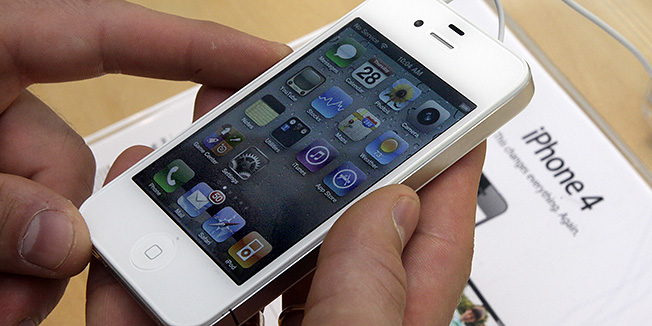 FILE - In this April 28, 2011 photo, a customer holds an iPhone at the Apple store on New York's Upper West Side. Apple Inc., the worlds most valuable company, on Tuesday, April 24, 2012 trumped skeptics once again by reporting blow-out iPhone sales. Apple says it sold 35 million iPhones in the quarter, almost twice as many as it sold a year ago and above analyst expectations.  (AP Photo/Richard Drew)