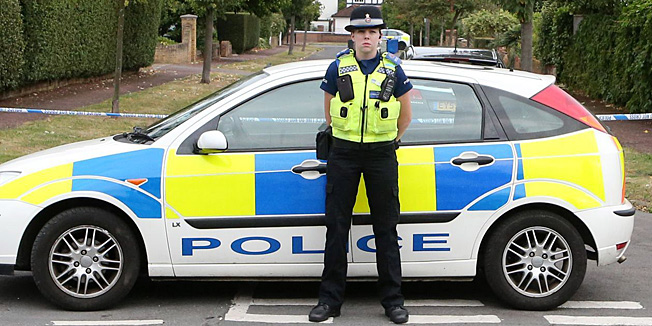 The home of Saad al-Hilli, in Claygate, England, who was shot dead with three others while vacationing in the French Alps, continues to be guarded by Surrey Police, who are assisting French police, Monday Sept. 10, 2012. Authorities say they are probing whether an alleged financial dispute between Saad al-Hilli and his brother Zaid played a role, though the surviving brother has denied any conflict. (AP Photo/PA, Steve Parsons) UNITED KINGDOM OUT  NO SALES  NO ARCHIVE
