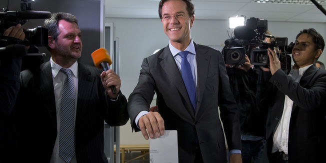 Dutch Prime Minister and Liberal Party leader Mark Rutte casts his vote for parliamentary elections in The Hague, Netherlands, Wednesday Sept. 12, 2012. (AP Photo/Peter Dejong)