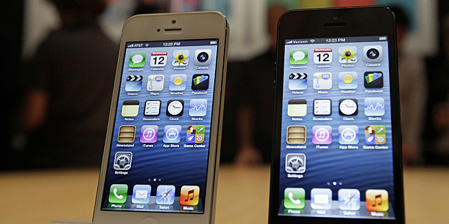 The new Apple iPhone 5 is displayed Wednesday Sept. 12, 2012 following the introduction of new products in San Francisco.  The iPhone 5 is a blend of beauty, utility and versatility. (AP Photo/Eric Risberg)