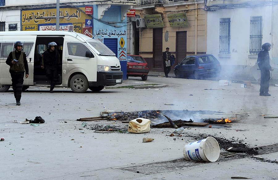 Police patrol in a street in Tunis, Thursday Jan. 13, 2011. A protester was fatally shot and an American journalist was hit in the leg by police gunfire Thursday as rioting youths clashed with authorities in Tunisia's capital for the second day, witnesses said.The violence in the heart of Tunis sharply escalated a conflict between protesters angry over unemployment and repression and an authoritarian government that appears more and more willing to use force to put down its greatest challenge in decades. (AP Photo/Hedi Ben Salem)