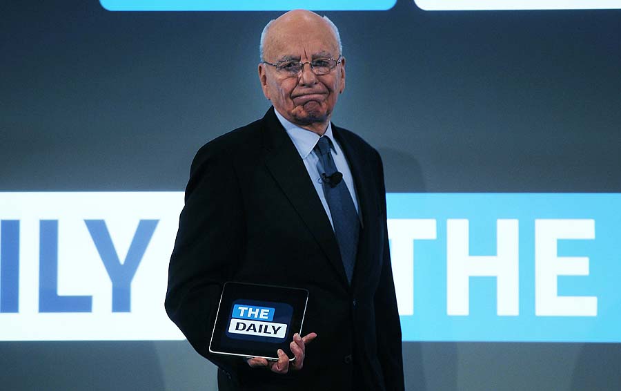 NEW YORK, NY - FEBRUARY 02: News Corp. CEO Rupert Murdoch walks on stage with an iPad for the launch of his new online newspaper for the Apple iPad called The Daily on February 2, 2011 at the Guggenheim Museum in New York City. The new media product is owned by News Corp. and will be sold for 14 cents a day.   Spencer Platt/Getty Images/AFP== FOR NEWSPAPERS, INTERNET, TELCOS & TELEVISION USE ONLY ==